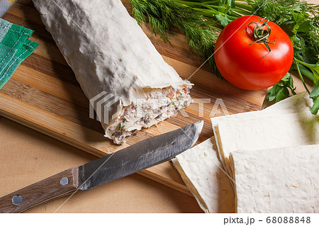 Pita bread or lavash wrapped with cottage cheese 68088848