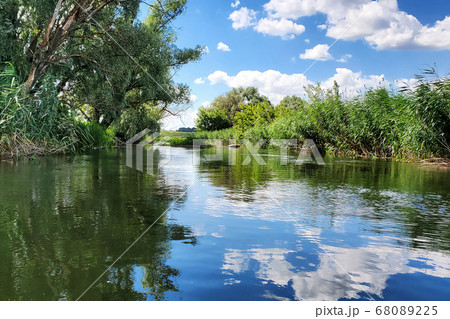 River landscape and water reflections River landscape and water reflections 68089225