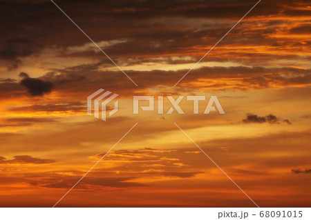 Sunset lighting and orange sky with cloud as 68091015