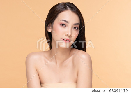 Beautiful Asian woman looking at camera smile with clean and fresh skin Happiness and cheerful with positive emotional,isolated on Beige background,Beauty Cosmetics and spa Facial treatment Concept Beautiful Asian woman looking at camera smile with clean and fresh skin Happiness and cheerful with positive emotional,isolated on Beige background,Beauty Cosmetics and spa Facial treatment Concept 68091159