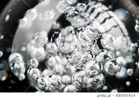 Bubbles in glass transparent ball on black background 68093914