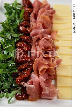 prosciutto cheese and sun-dried tomatoes prosciutto cheese and sun-dried tomatoes 68094814