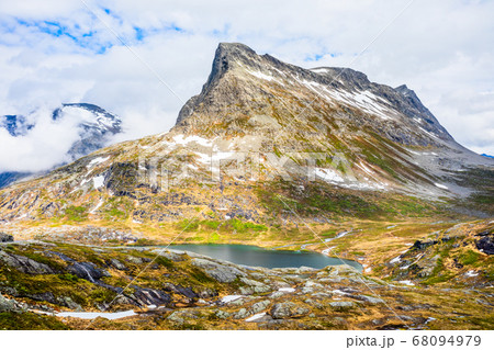 Snow mountain peak around Alnesvatnet lake 68094979