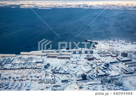 Aerial view to the fjord and snow streets of 68094988