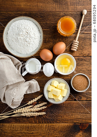 Ingredients for baking on a wooden table background 68095294