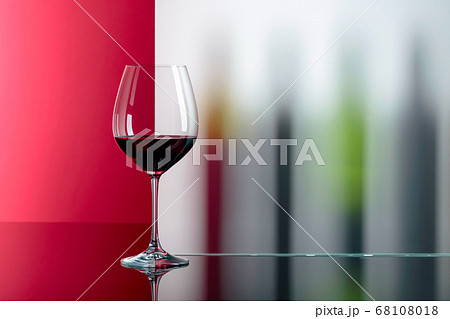 Red wine on a black table. Red wine on a black table. 68108018