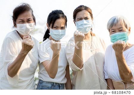 Group of people wearing medical mask to prevent infection from spreading of Covid-19,asian family raised a fists and prepare for the epidemic crisis or fight the Coronavirus,concept of encouragement Group of people wearing medical mask to prevent infection from spreading of Covid-19,asian family raised a fists and prepare for the epidemic crisis or fight the Coronavirus,concept of encouragement 68108470
