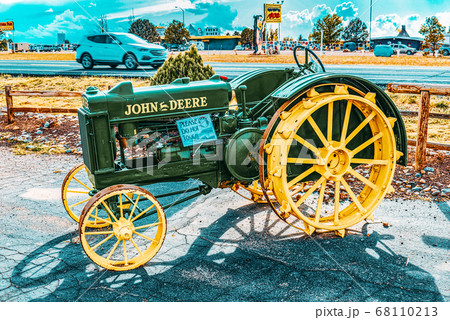 An old tractor stands in the fields of Arizona. An old tractor stands in the fields of Arizona. 68110213