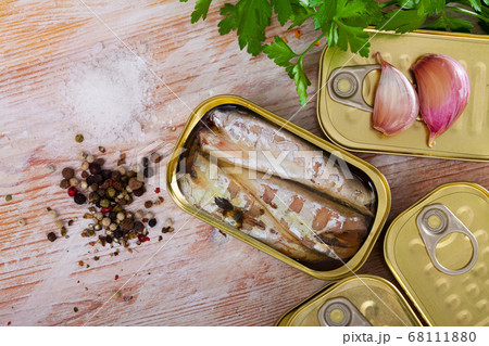 Preserved mackerel fish on wooden table Preserved mackerel fish on wooden table 68111880