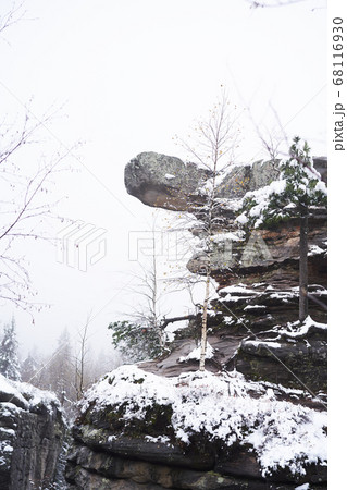 Snow-covered rocks, trekking, mountains, friends on a trek Snow-covered rocks, trekking, mountains, friends on a trek 68116930