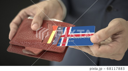 Man pulls credit card with flag of Iceland out of his wallet, fictional card number 68117883