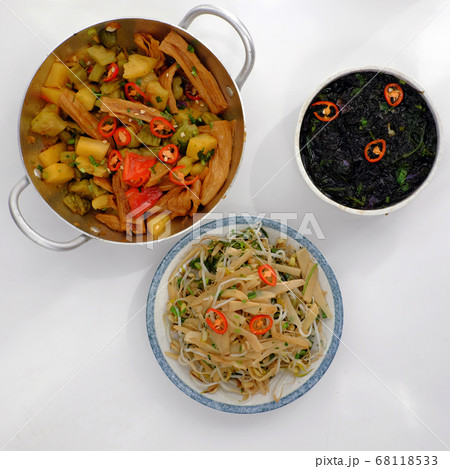 daily meal with Vietnamese vegan food, tofu skin cook with sauce, fried bamboo shoot, seaweed soup daily meal with Vietnamese vegan food, tofu skin cook with sauce, fried bamboo shoot, seaweed soup 68118533