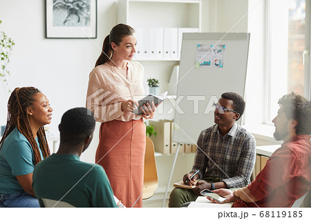 Woman heading Meeting in Office 68119185