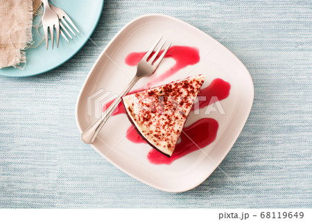 Red Velvet cake slice on blue background. Red Velvet cake slice on blue background. 68119649