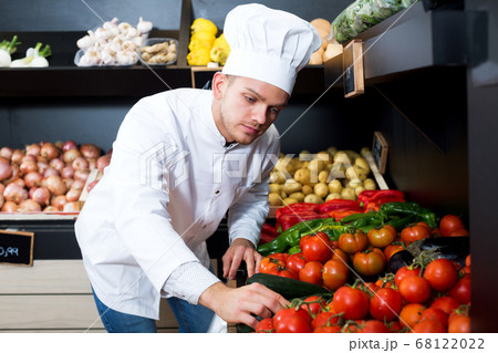 Man cook deciding on best vegetables 68122022