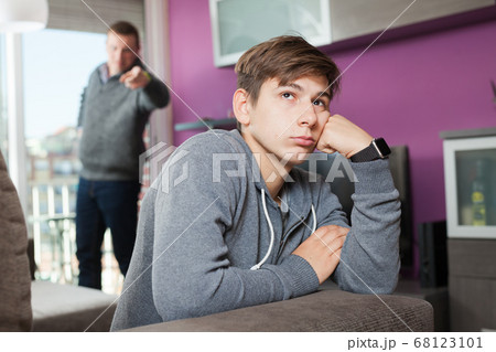 Angry father screaming at offender son Angry father screaming at offender son 68123101