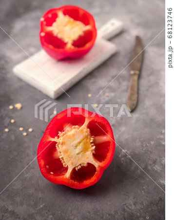 halved red bell pepper on a cutting board 68123746