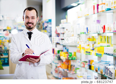 Pharmacist checking drugs in pharmacy 68123747