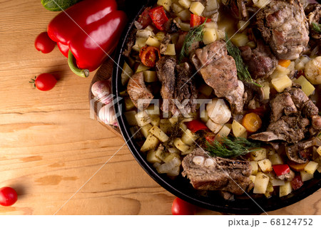 Grilled pork ribs on vegetables. Main course with a side dish. 68124752