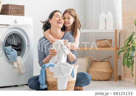 family doing laundry family doing laundry 68125133