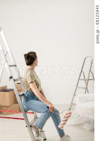 Looking at painted wall 68125845