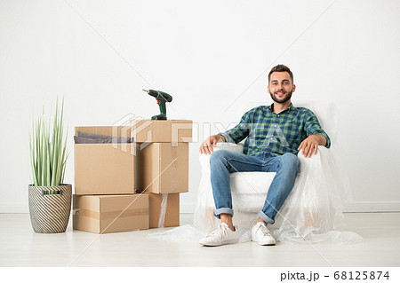 Relaxed man in new house 68125874