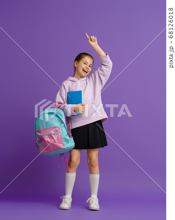 Kid with backpack on color background. 68126018