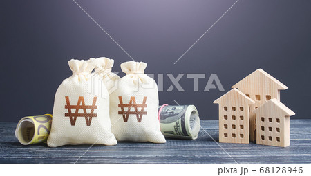 South korean won money bags and residential buildings figures. Investments in real estate. Mortgage loan. Municipal budget management. Financing the construction and renovation of housing. Taxes. South korean won money bags and residential buildings figures. Investments in real estate. Mortgage loan. Municipal budget management. Financing the construction and renovation of housing. Taxes. 68128946