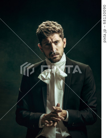 Young man as Dorian Gray on dark background. Retro style, comparison of eras concept. 68130090