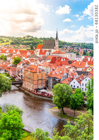 Panoramic view of Cesky Krumlov with St Vitus church in the middle of historical city centre. Cesky Krumlov, Southern Bohemia, Czech Republic Panoramic view of Cesky Krumlov with St Vitus church in the middle of historical city centre. Cesky Krumlov, Southern Bohemia, Czech Republic 68130382
