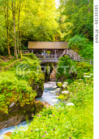 Entrance Bridge to Sigmund Thun Gorge. Cascade valley of wild Kapruner Ache near Kaprun, Austria Entrance Bridge to Sigmund Thun Gorge. Cascade valley of wild Kapruner Ache near Kaprun, Austria 68130385