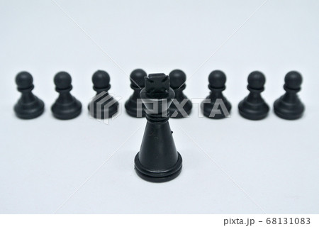 Black chess pieces all together arranged randomly on white background. Black chess pieces all together arranged randomly on white background. 68131083