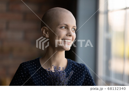 Happy young sick woman look in distance feeling optimistic Happy young sick woman look in distance feeling optimistic 68132340