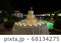 large wedding cake against the background of the pool, slider, night 68134275
