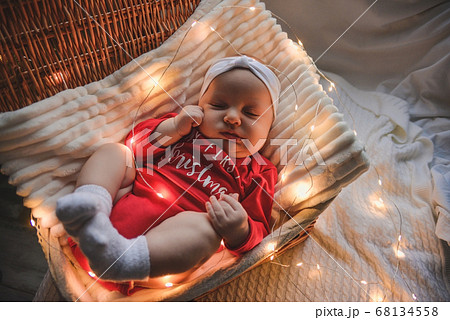 Little slipping baby boy with christmas clothes in Little slipping baby boy with christmas clothes in 68134558