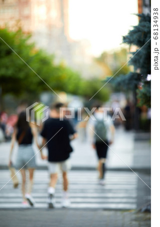 blurred people crossing street 68134938