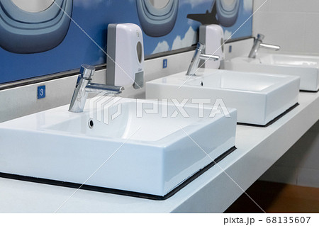 Themed modern design of the airport toilet. 68135607