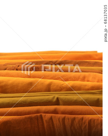 Yellow robe in many Earth tone for monk on white background. 68137035