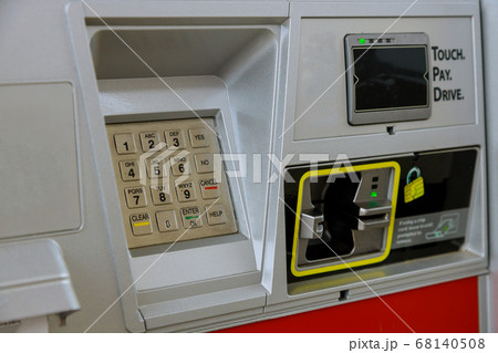 Close up of moment of payment by credit card into 68140508