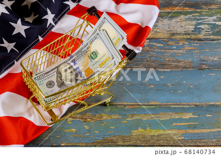 Shopping cart financial concept with US dollars 68140734