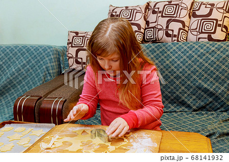Little girl in making with preparing the dough on 68141932