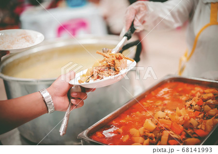 Providing free food for the poor to fill their 68141993