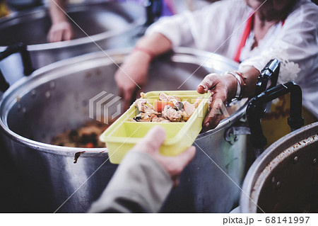 Providing free food for the poor to fill their Providing free food for the poor to fill their 68141997