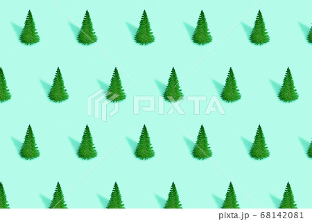 Christmas trees on green background. Minimal 68142081