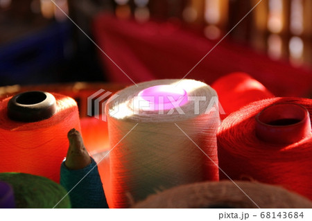 lighting shadow on yarn spools on bamboo basket lighting shadow on yarn spools on bamboo basket 68143684