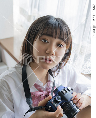 カメラと女子高生の写真素材