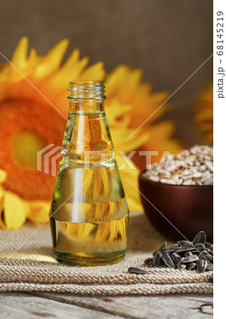 Sunflower oil in bottle glass with seed Sunflower oil in bottle glass with seed 68145219