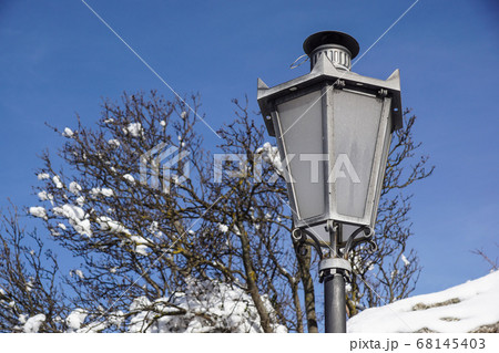 Vintage Street lamp post at winter day 68145403
