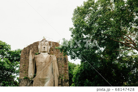 Aukana Buddha Carved stone statue in Colombo city. Sri Lanka Aukana Buddha Carved stone statue in Colombo city. Sri Lanka 68147428