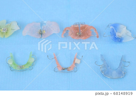 Dental retainers, removable plates and other orthodontic appliances in clinic. Dental retainers, removable plates and other orthodontic appliances in clinic. 68148919
